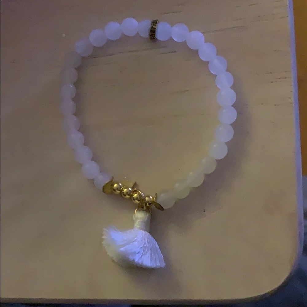 White bead bracelet with tassel